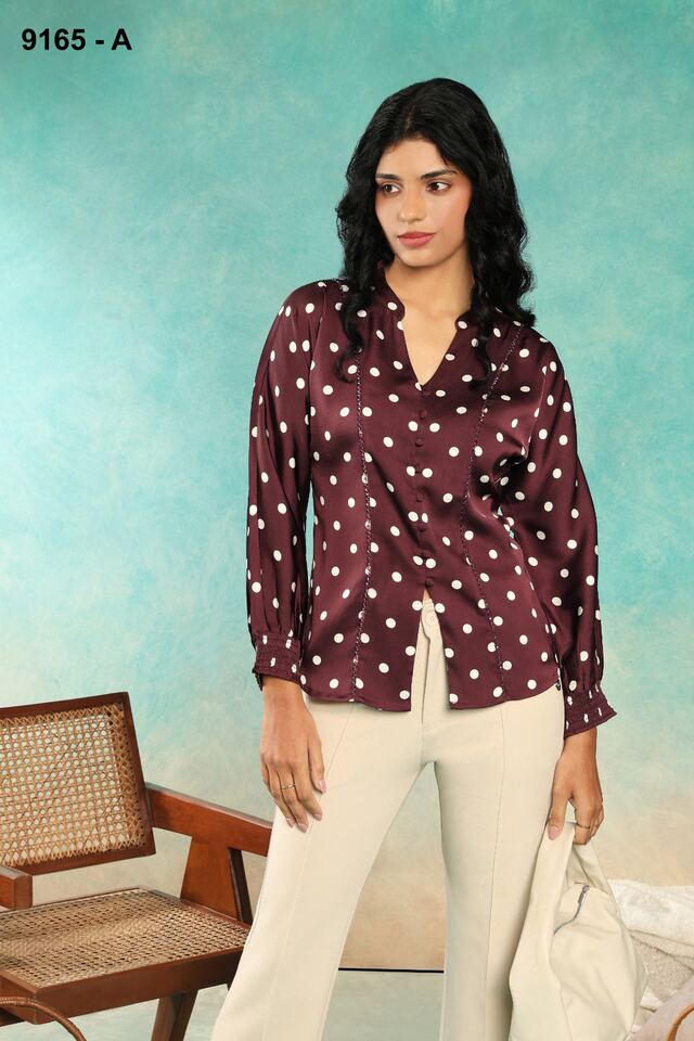 Wine polka-dot satin shirt with ivory trousers