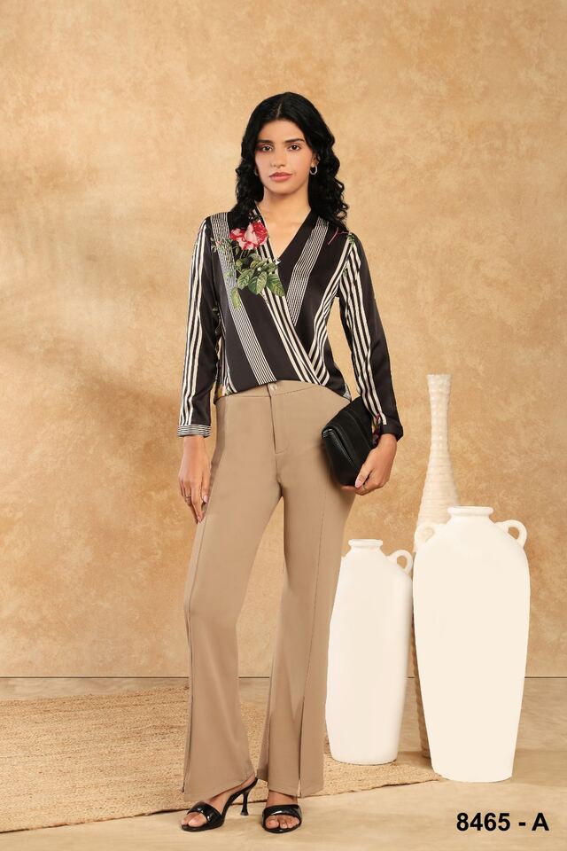 Monochrome striped wrap shirt with beige trousers and a black clutch
