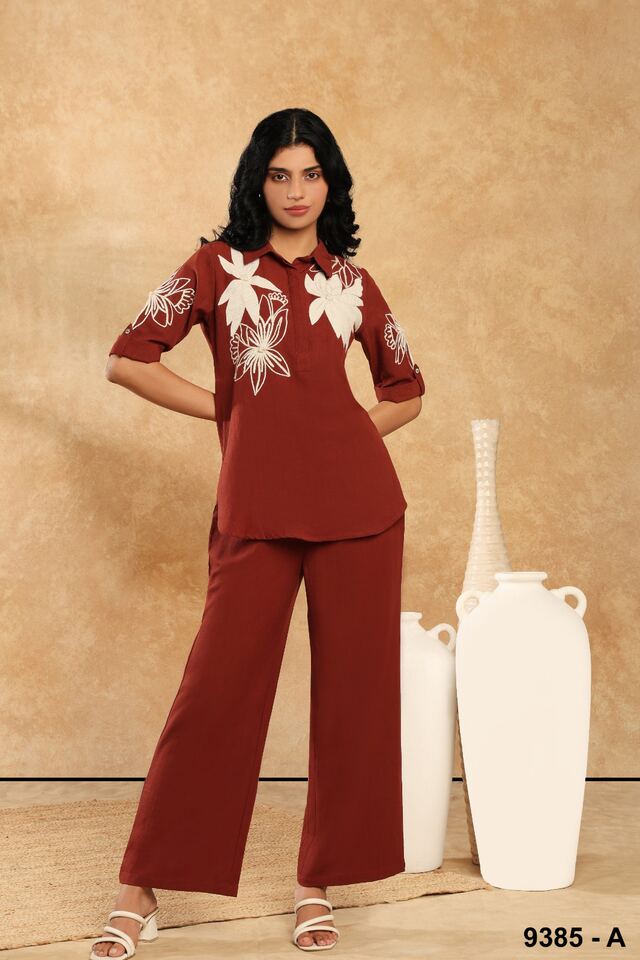 Rust co-ord set with tonal ivory floral embroidery across the shirt