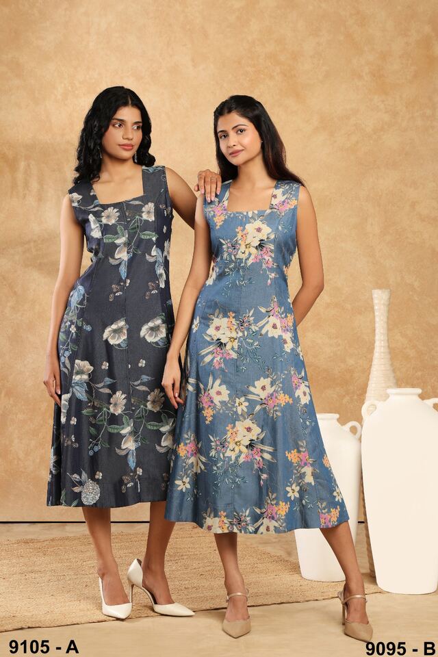 Two women in blue floral sleeveless dresses in complementary shades