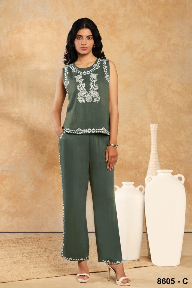 Sleeveless sage co-ord set with delicate white embroidery at the neckline and hem