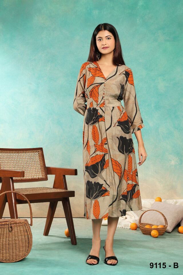 Ivory dress with oversized orange and charcoal florals and a black belt