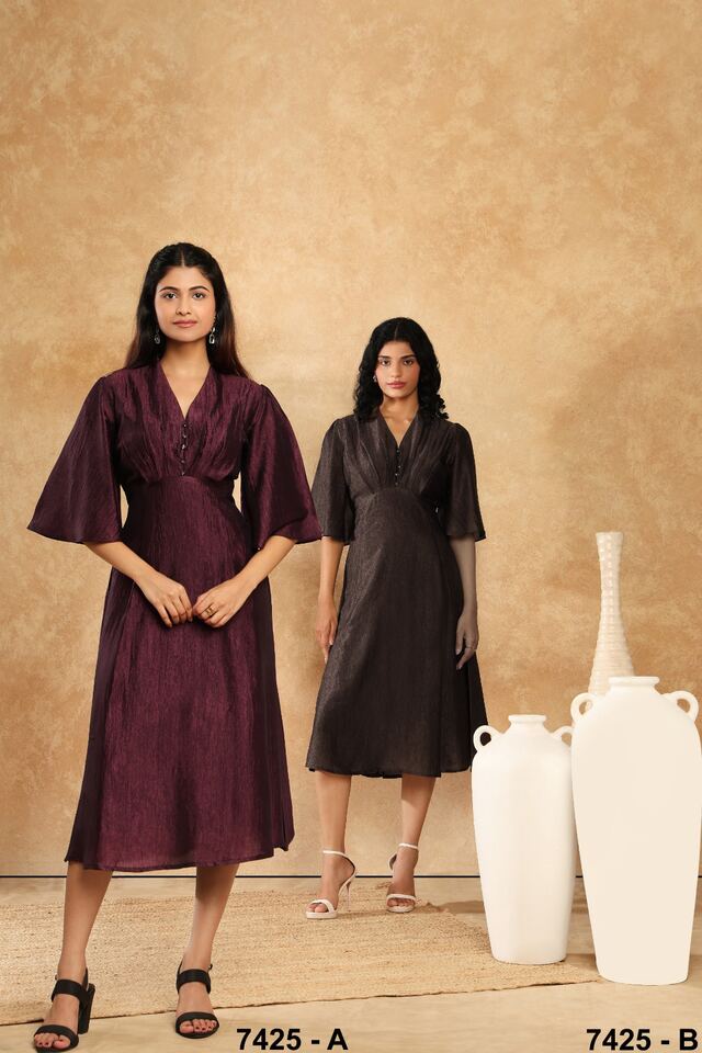 Two women in wine and chocolate fluid dresses with fluttered sleeves