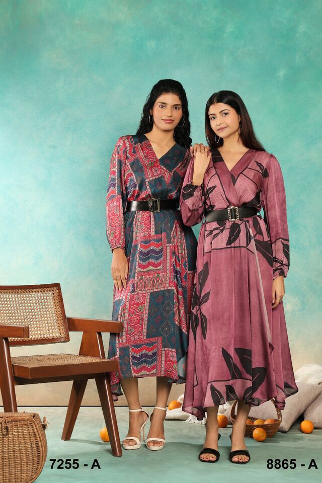 Two women in belted patchwork-print midi dresses in pink, blue and mauve