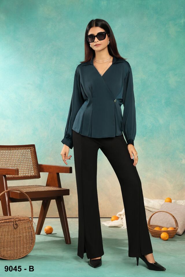 Deep teal satin wrap top with black flared trousers and pointed heels